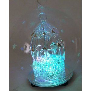 Nativity Blown Glass Ornament Gold Stars Color Changing Light Up Globe 4.5 in.